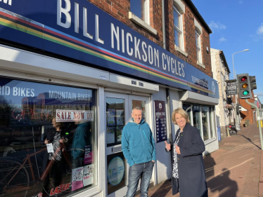 Katherine and owner outside Bill Nickson Cycles