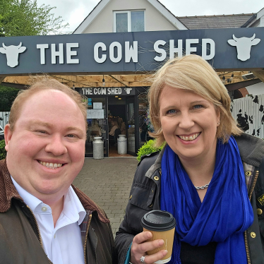 Katherine and member of staff stopping at The Cow Shed