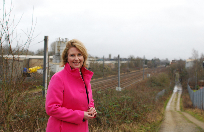 Katherine Fletcher stood in front of a train line.