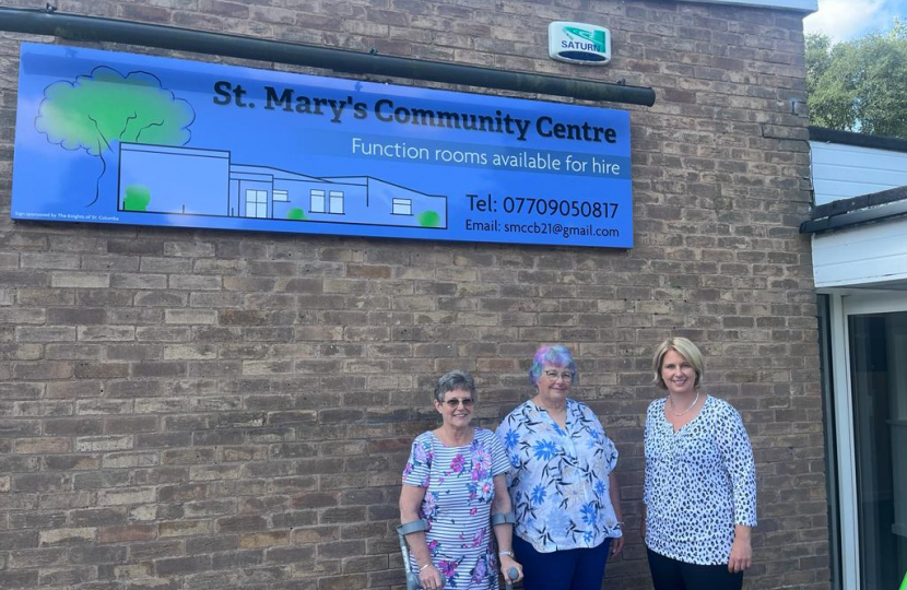 Katherine outside St Mary's Community Centre with two of the volunteers