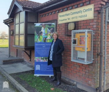 Katherine Fletcher stood outside Penwortham Community Centre with a banner advertising surgeries.