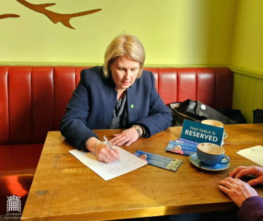 Katherine Fletcher sat at a table in Booth's Longton, taking notes for a constituent.
