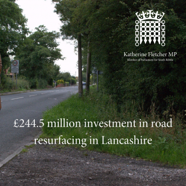 Road with words £244.5 million investment in road resurfacing in Lancashire across it.