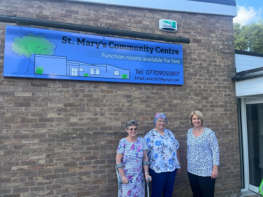 Katherine outside St Mary's Community Centre with two of the volunteers